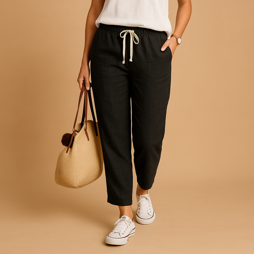 Amelia lightweight stretch trousers in black with a drawstring waist, worn with a white top and white trainers