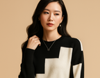 Astrid loose-fit sweater in black with a cream colour-block panel on the front