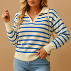 Cream knit sweater with blue stripes and a polo collar, styled with light blue jeans