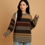 Elise oversized knit sweater with a fair isle pattern in olive, brown and burgundy, worn with blue jeans