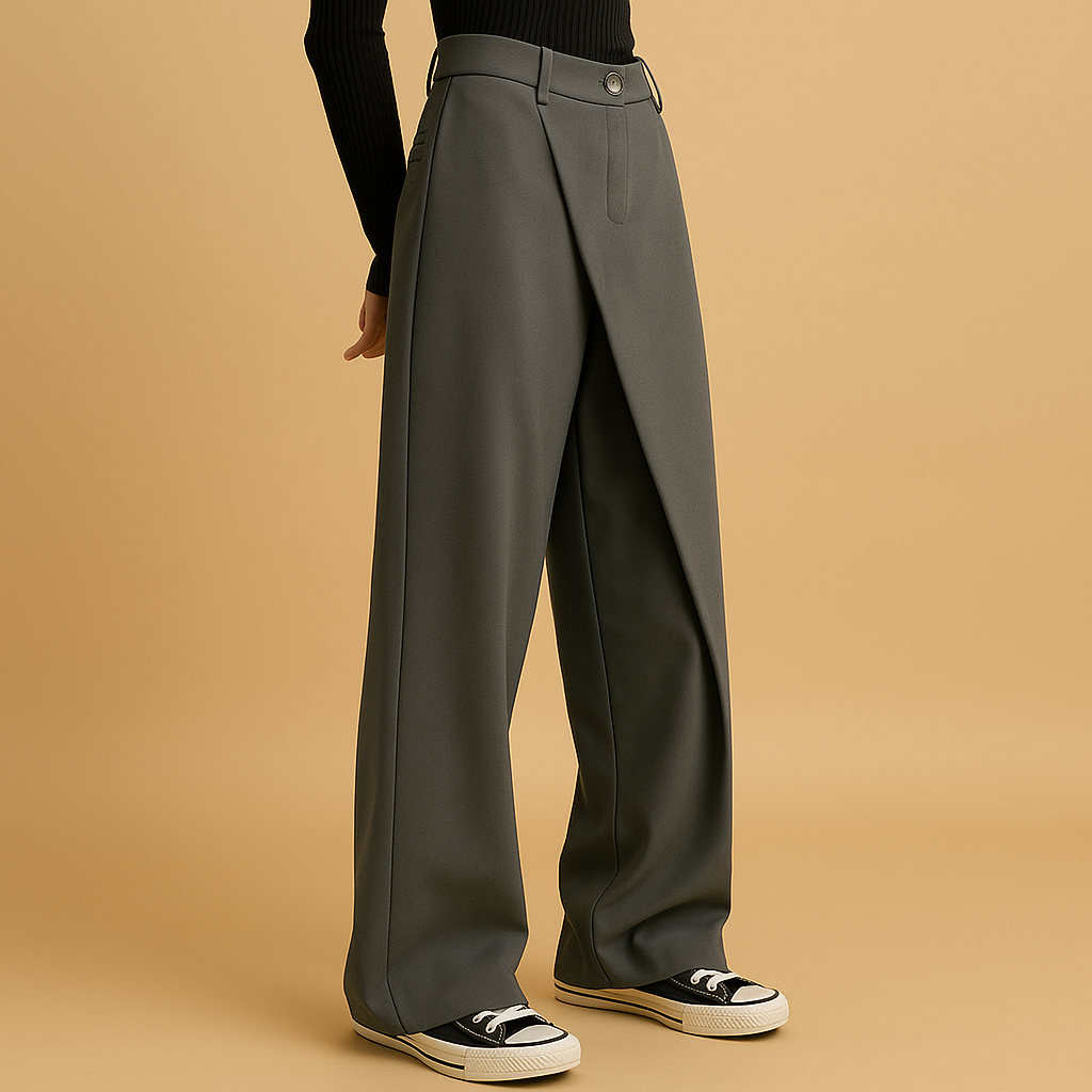 Mabel asymmetric baggy trousers in olive green with a wide relaxed leg, worn with black and white trainers