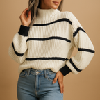 Scarlett striped knit sweater in cream and black with a high collar, worn with blue jeans