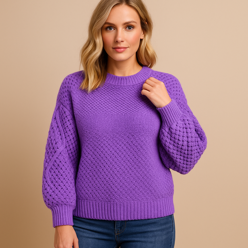 Tirza soft knit sweater in purple with a textured weave and round neck, worn with dark jeans